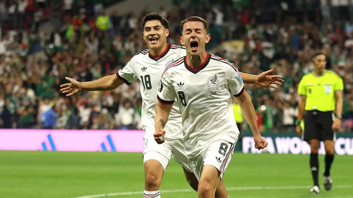 Alvaro Fidalgo celebrating after scoring a goal during a soccer match at Mexico City Stadium.