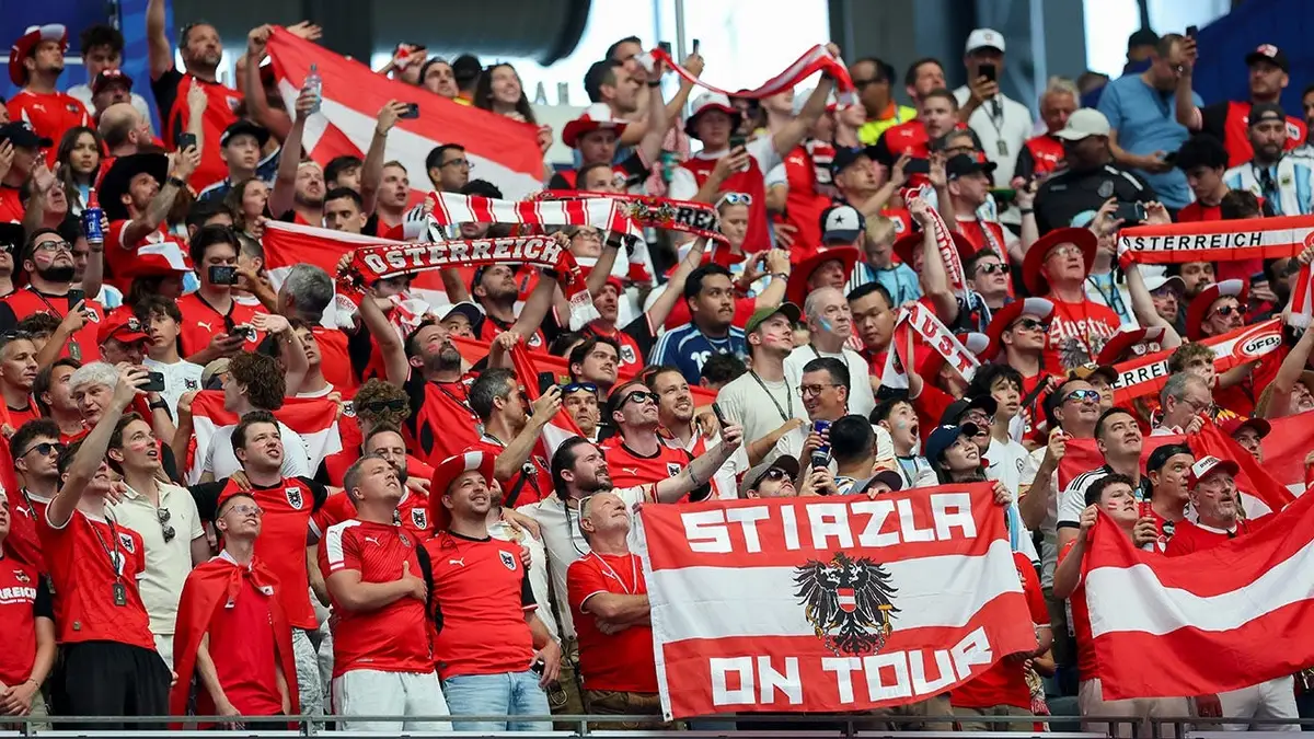 Supporters of Austria cheering at Dallas Stadium during FIFA World Cup 2026 match.