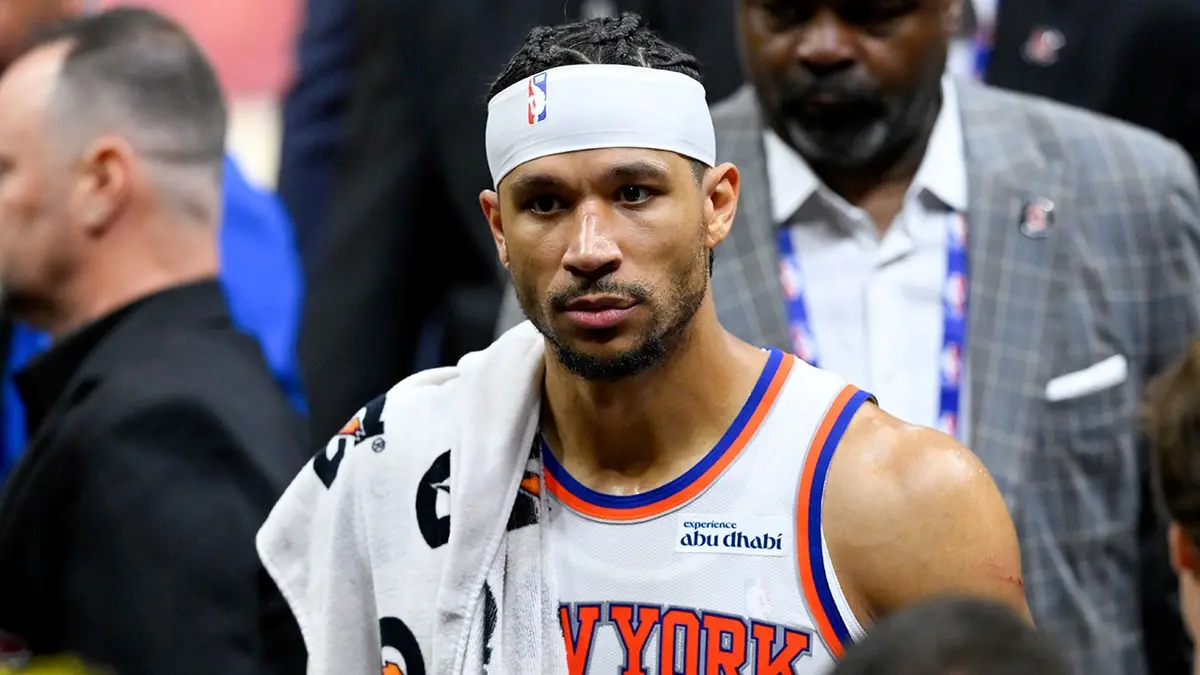 New York Knicks forward Josh Hart looking on during NBA playoff game at Rocket Arena.