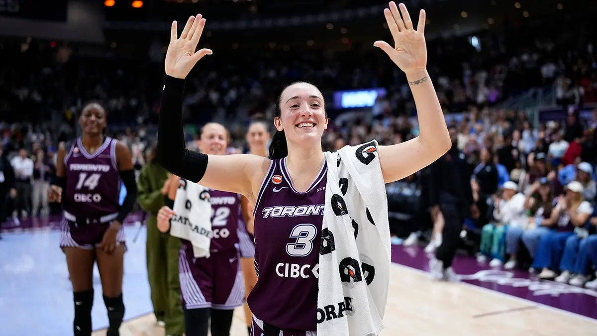 Marina Mabrey celebrating on the basketball court at Coca-Cola Coliseum in Toronto