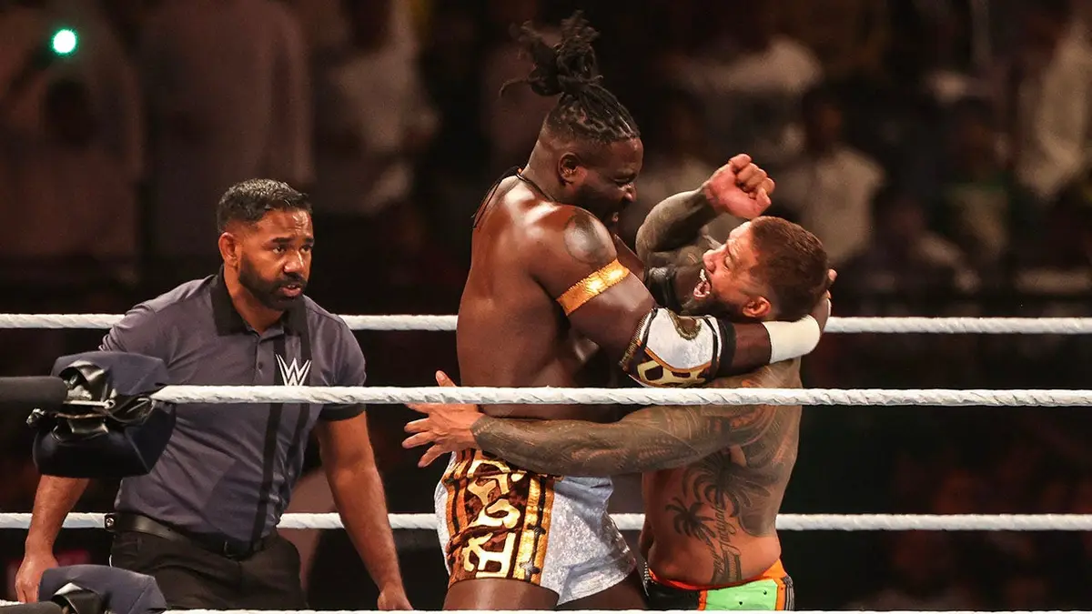 Nigerian wrestler Oba Femi and US wrestler Jey Uso fighting in a wrestling ring